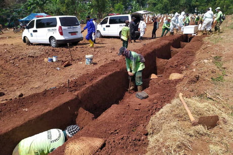 8 Maskless People Made To Dig Graves As Punishment In East Java City