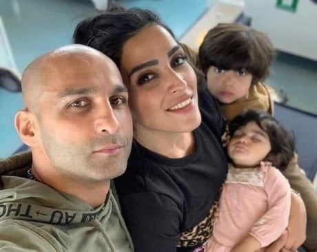 Boxer Ahmad Shirazi and his wife take a family photo where his wife didn&rsquo;t have hijab. In response, the Iranian regime sentenced them both to 16 years in prison and 74 lashes for &ldquo;spreading debauchery and prostitution.&rdquo;