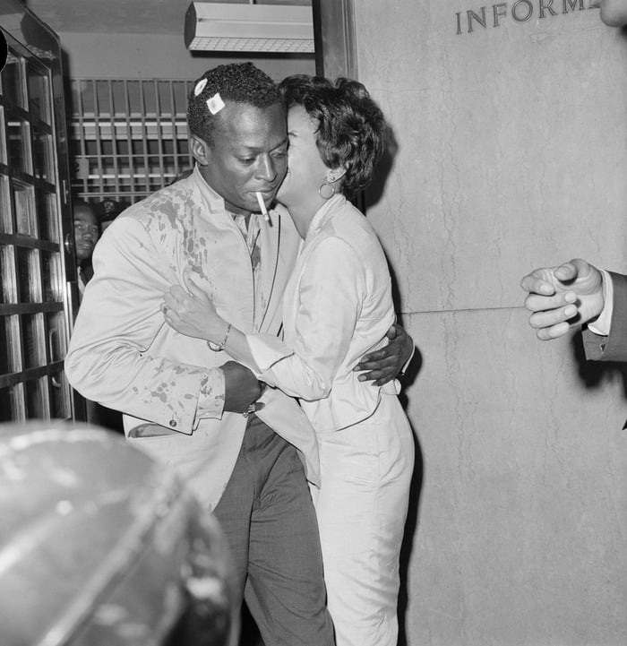 Miles Davis is kissed by his wife, as he is released from jail in 1959.