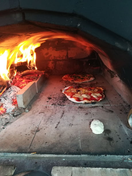Selfmade pizza in a selfmade oven