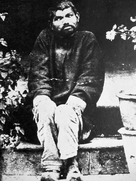 The man in the picture is Dina Sanichar,Widely believed to be raised by the wolves. He was born in India and was found in the deep jungles of Uttar Pradesh by the hunters in 1872.They found him hunting alongside the wolves and noted that he was walking on 