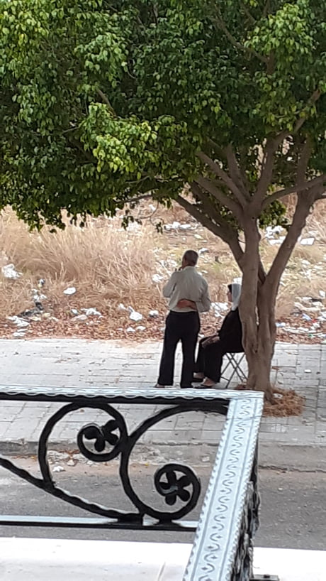This man was walking with his wife, holding a foldable chair and he'd stop when she gets tired to put the chair down and wait for her to rest.