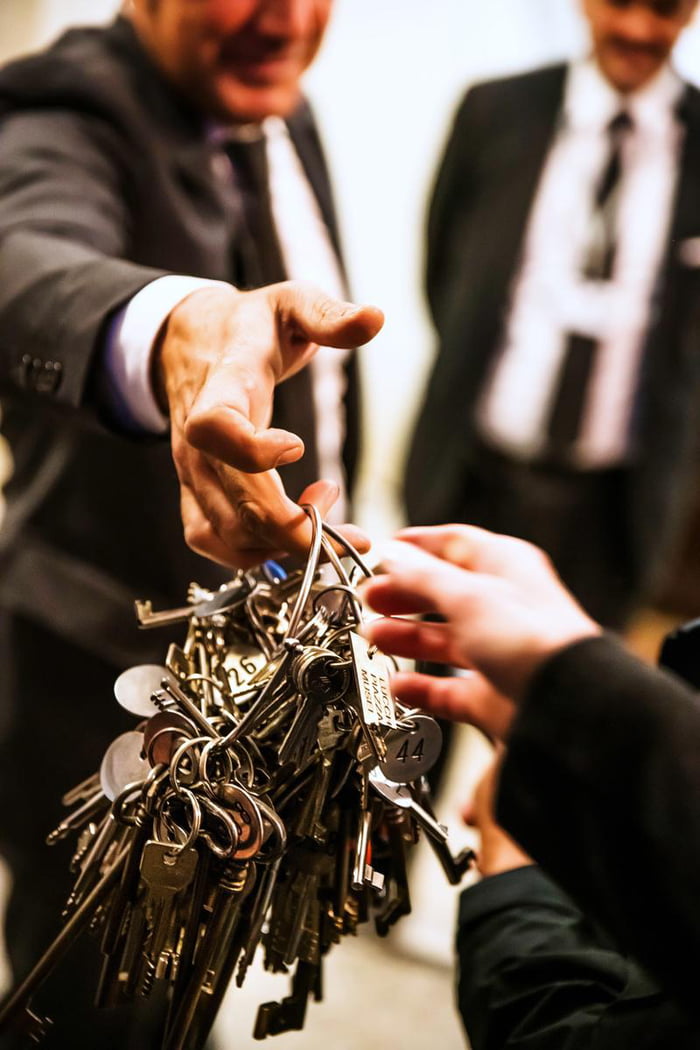 Vatican Key master, known as "Clavigero", handing over a ring of keys that contains the original key for the Sistine Chapel.