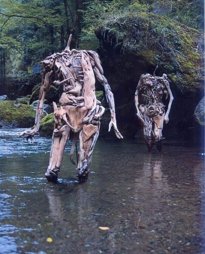 Wooden sculptures at a creek